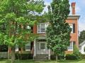 This pink brick Federal house dates to the 1820s. Note the simplicity and dignity of the Palladian style doorway and overwindow. 