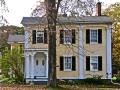 Built in the 1830s, this Federal house features Ionic pilasters supporting blind arcades . The porch is a Victorian addition.