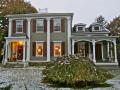 This c.1825 Federal has a 3-bay blind-arcaded fa�ade, Ionic pilasters, hip roof and balustrade. The porch is a Victorian addition. Once the residence of �David Harum.�