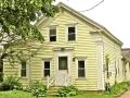 Built c. 1850, this Greek Revival house retains its original corner pilasters and entablature.