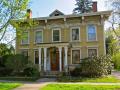 Dating to 1836, the simple five-bay form of the house and its gable end flanking chimneys suggest that it was originally built in the Federal Style and was later updated with Italianate brackets, window treatments and a porch.