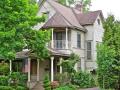 1890 Victorian that had been stripped of details and aluminum sided before being sensitively restored to glory with period appropriate porches and trim.