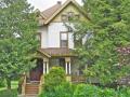 Dating to 1885, the plans for this house were likely purchased from architect Archimedes Russell. Note the neoclassical influence in the trim details. (The stained glass windows in the front doors include something rare in the Victorian era � nudity.)
